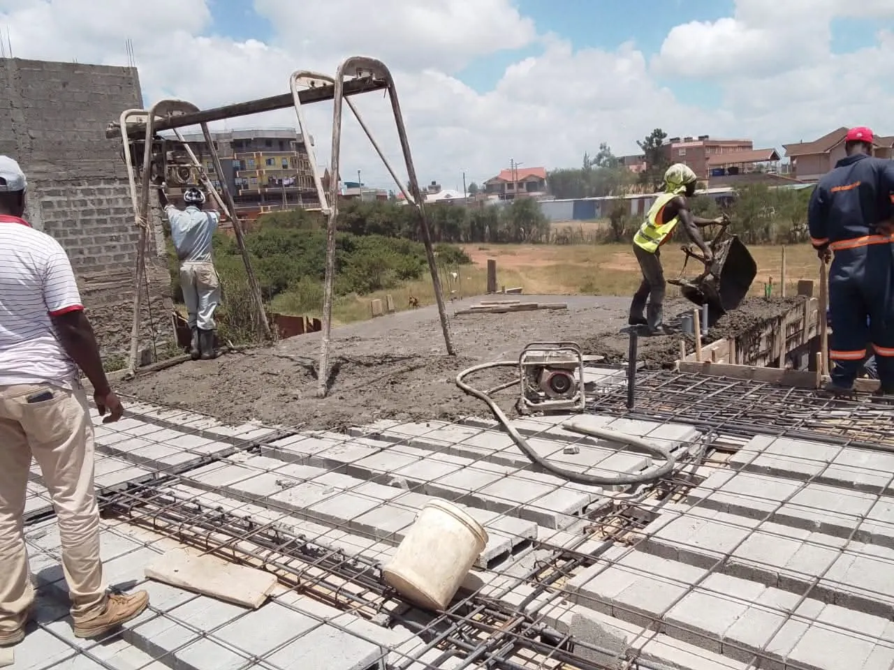 Construction workers installing a reinforced concrete floor slab